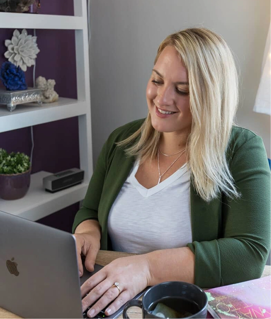 Nicole D'Andrea on a laptop